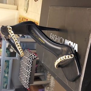 Selling a beautiful pair of Chan FN black size 7 stilettos new